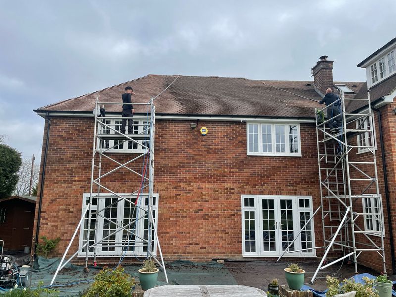 Roof cleaning carried out safely from scaffold towers by The Roof Moss Cleaners in Alcester